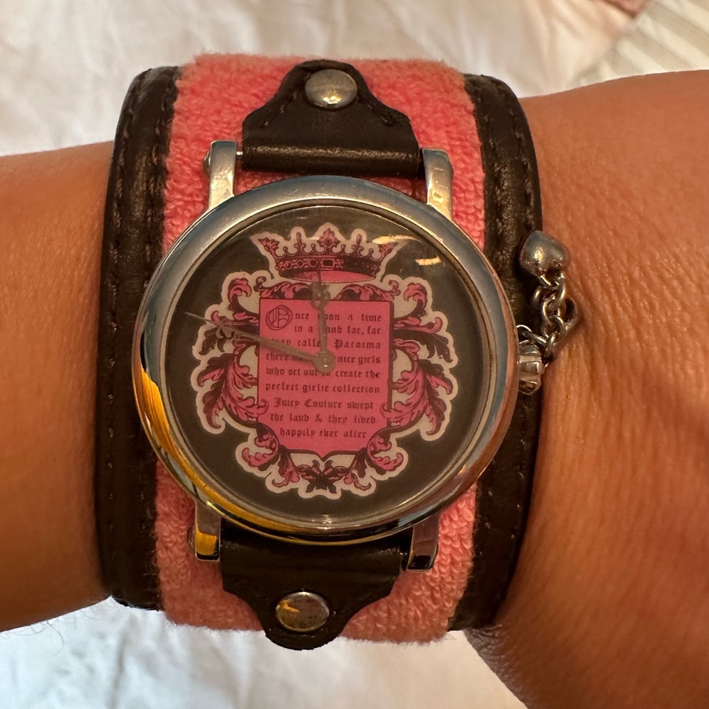 Juicy Couture Pink & Brown Watch with Ornate Dial and Wide Band.